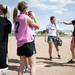 Lincoln senior Raven Lee (second from right) and other softball players laugh and smile during practice on Tuesday, May 7. Daniel Brenner I AnnArbor.com